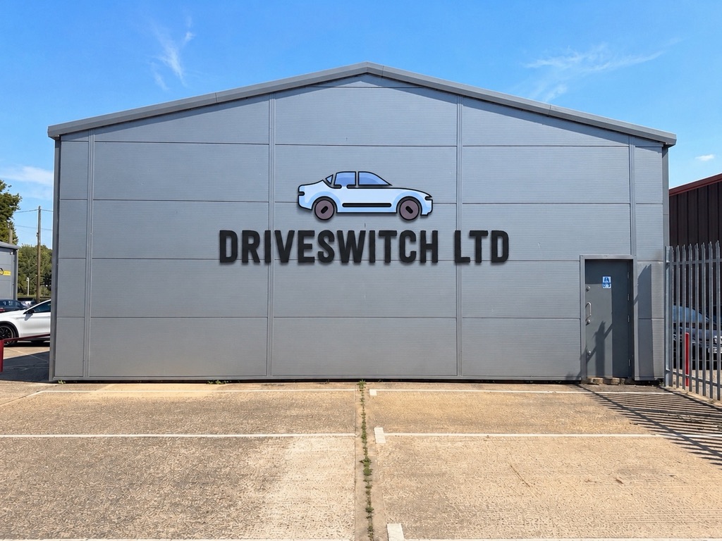 Driveswitch dealership building and empty forecourt under a blue sky