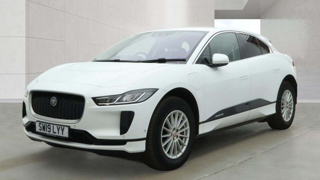 Original front three-quarter vehicle photo of the white Jaguar I-PACE SW19 LYY before editing